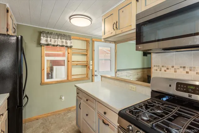 a kitchen with a stove and a sink