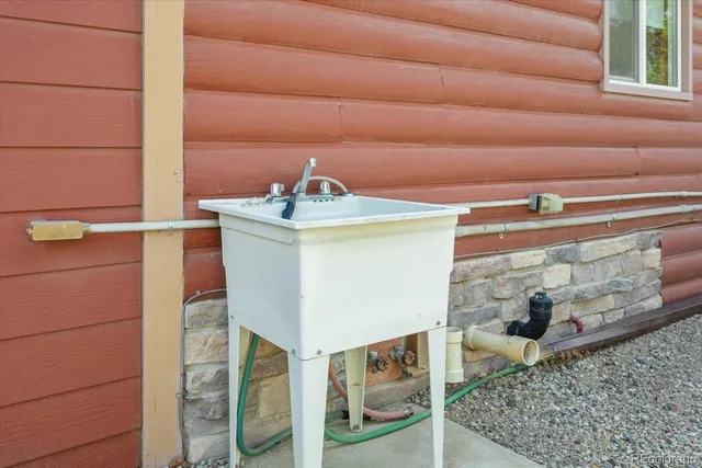 a view of a wooden house with a yard