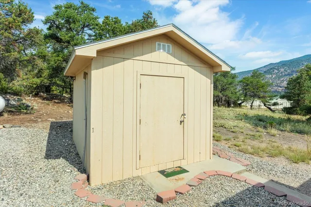 a view of a kitchen with a sink and a window