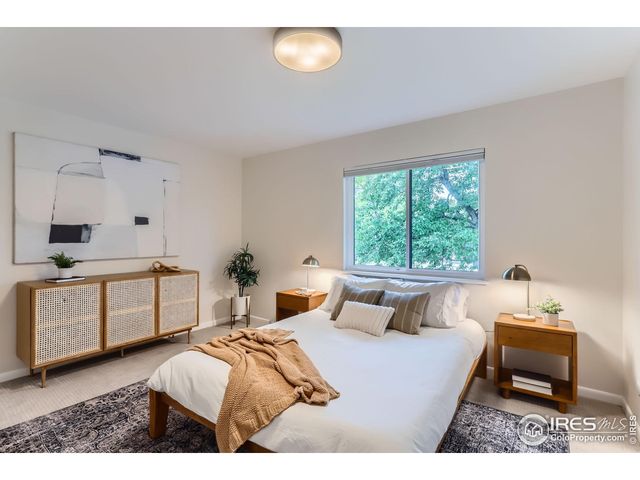 a bedroom with a bed and a table