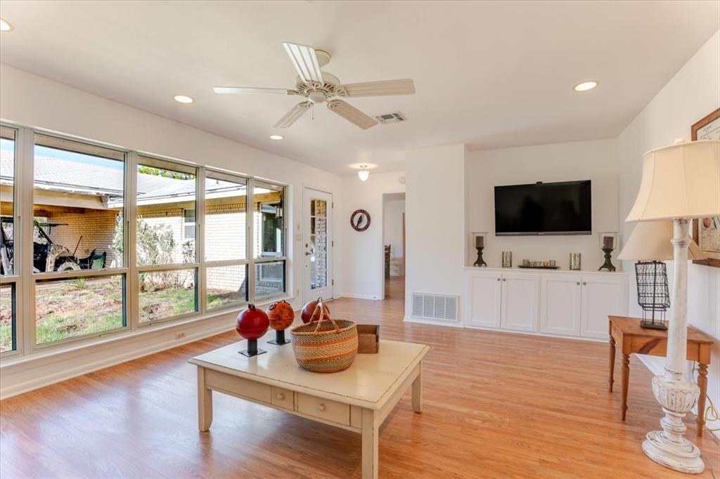 1674 Ming Bend Road Graham, TX 76450 - Photo 8 of 40 Wood-finish flooring, white built-in cabinetry, recessed lighting, and a ceiling fan with light fixture