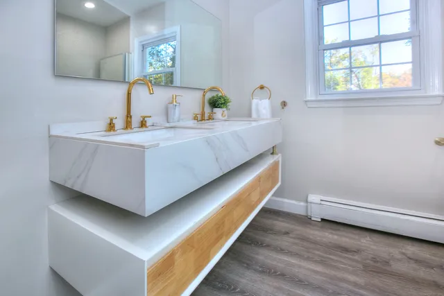 a room with a bed and window