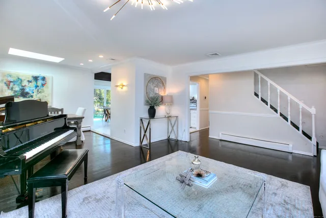 a living room with furniture and a table