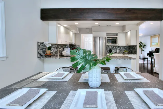 a view of living room with furniture and potted plant
