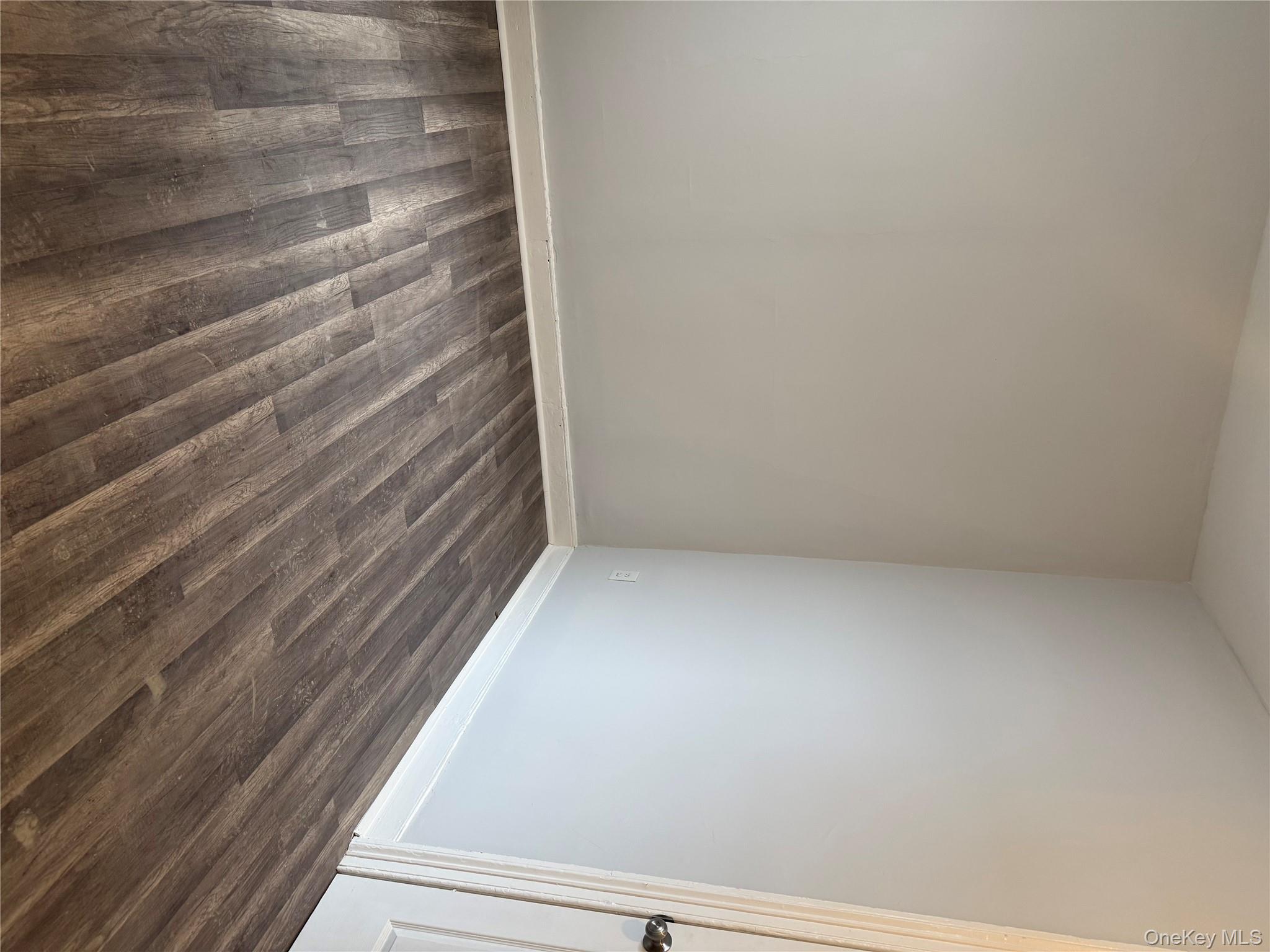 17 Conklin Street, Unit 1 Poughkeepsie, NY 12601 - Photo 11 of 17 Spare room with dark wood-type flooring and baseboards