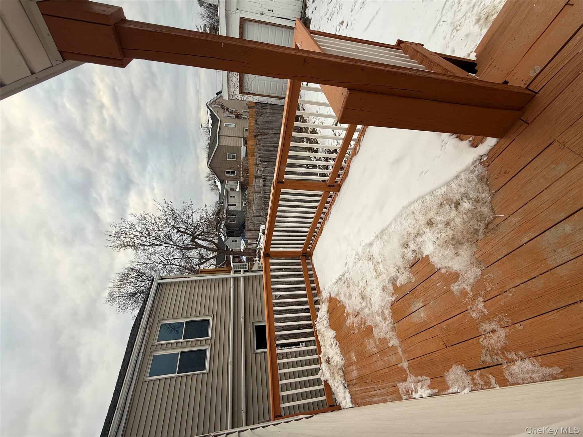 17 Conklin Street, Unit 1 Poughkeepsie, NY 12601 - Photo 16 of 17 Snow covered deck with a residential view