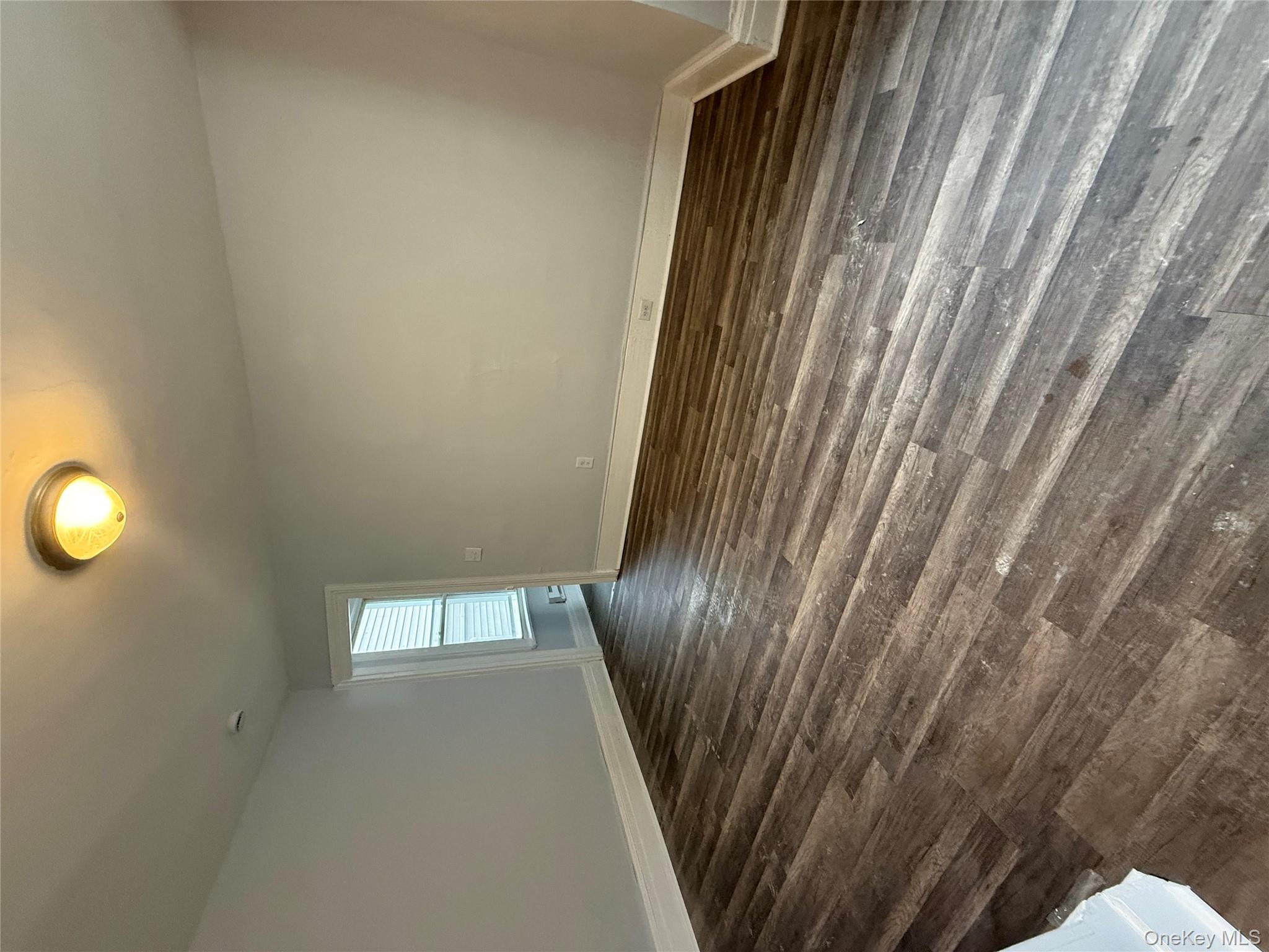 17 Conklin Street, Unit 1 Poughkeepsie, NY 12601 - Photo 3 of 17 Unfurnished room featuring baseboards and dark wood finished floors