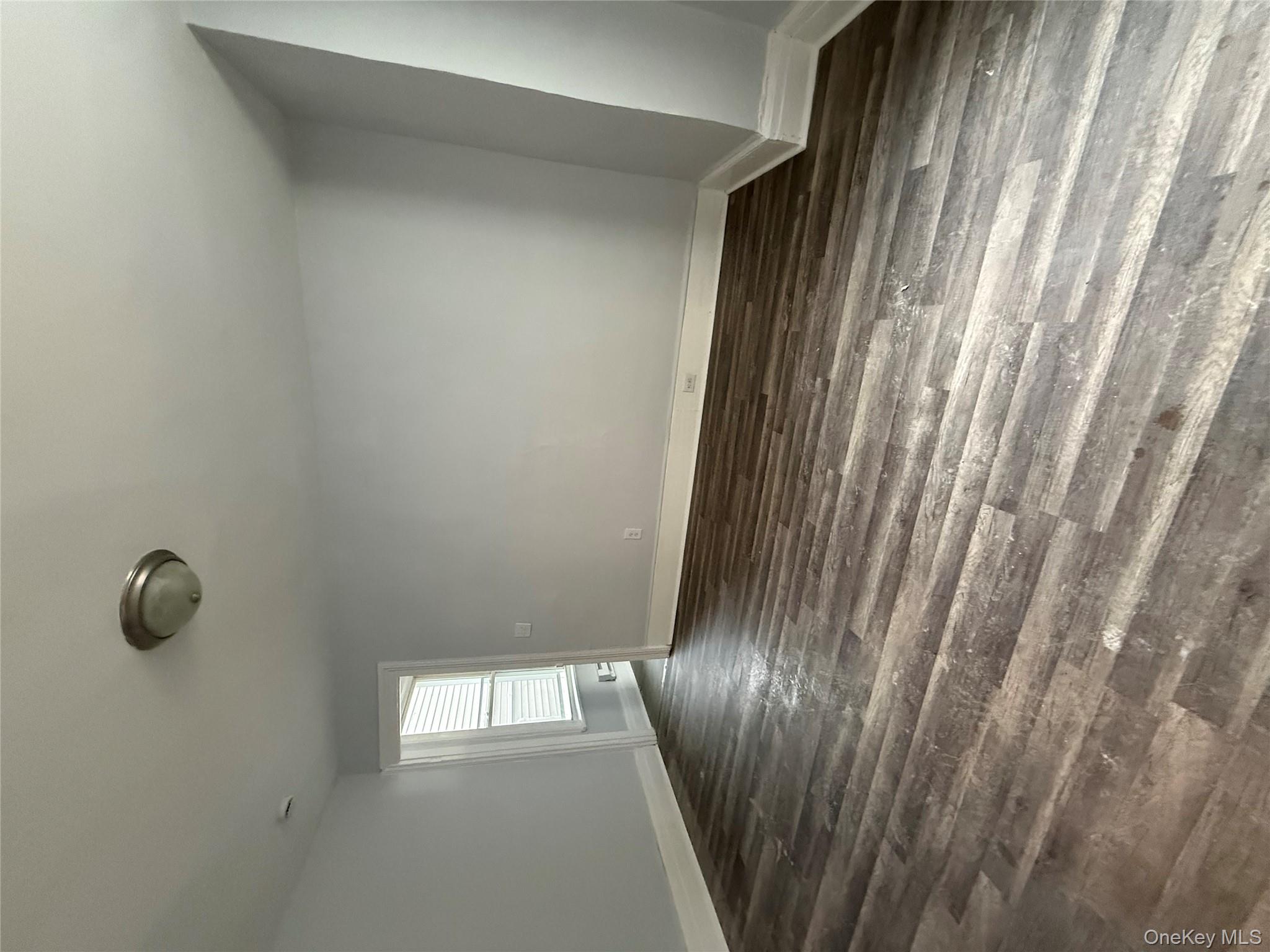 17 Conklin Street, Unit 1 Poughkeepsie, NY 12601 - Photo 4 of 17 Empty room with dark wood finished floors