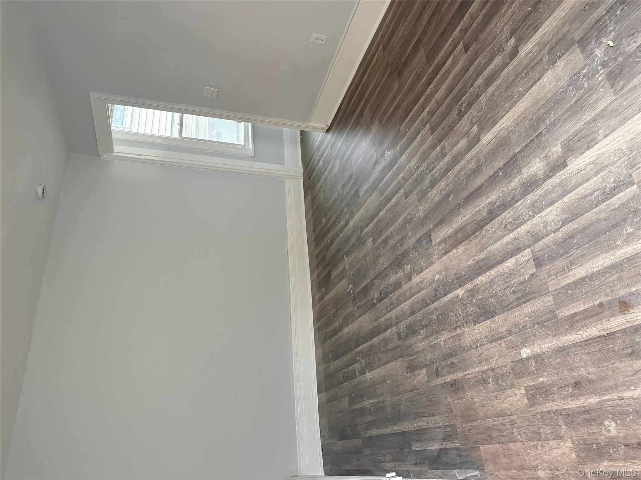 17 Conklin Street, Unit 1 Poughkeepsie, NY 12601 - Photo 5 of 17 Empty room featuring dark wood-style flooring