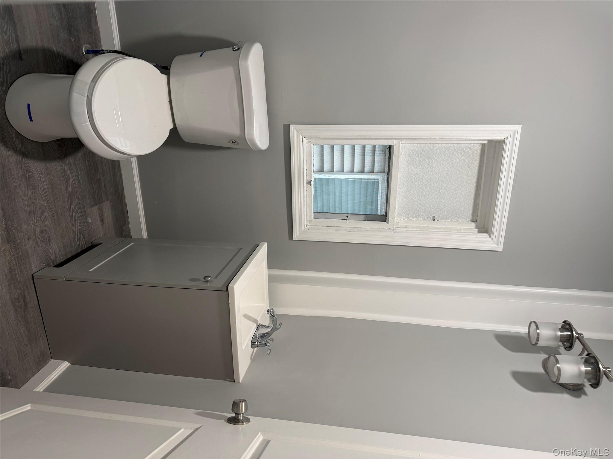 17 Conklin Street, Unit 1 Poughkeepsie, NY 12601 - Photo 8 of 17 Bathroom with vanity and dark wood-style flooring