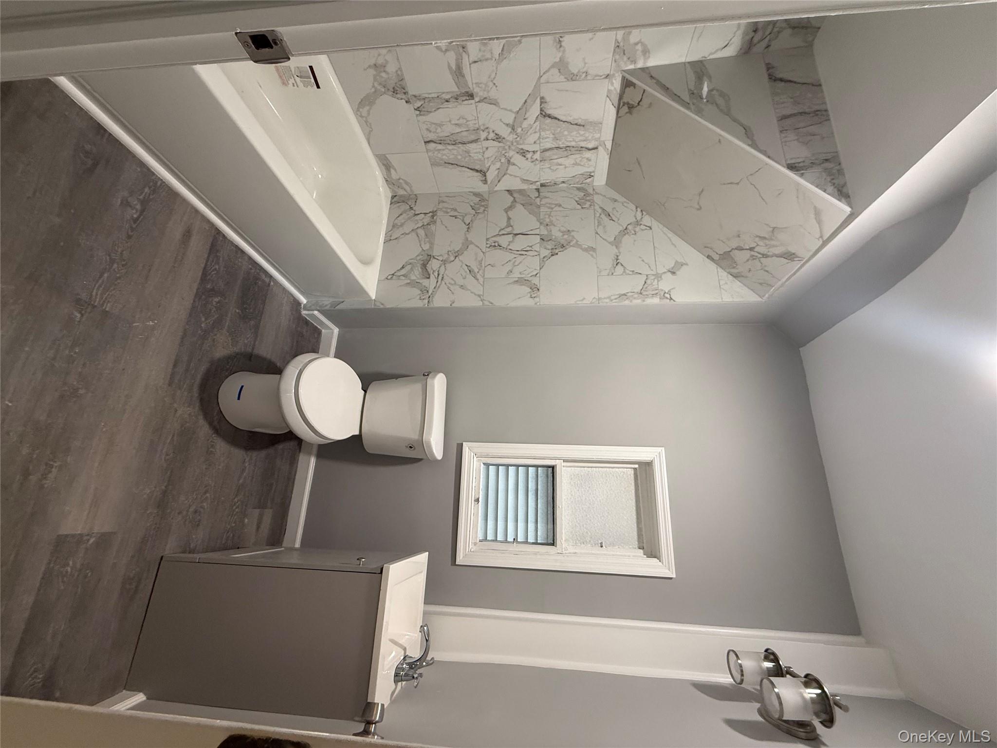 17 Conklin Street, Unit 1 Poughkeepsie, NY 12601 - Photo 10 of 17 Full bathroom with vanity, dark wood-type flooring, and tub / shower combination