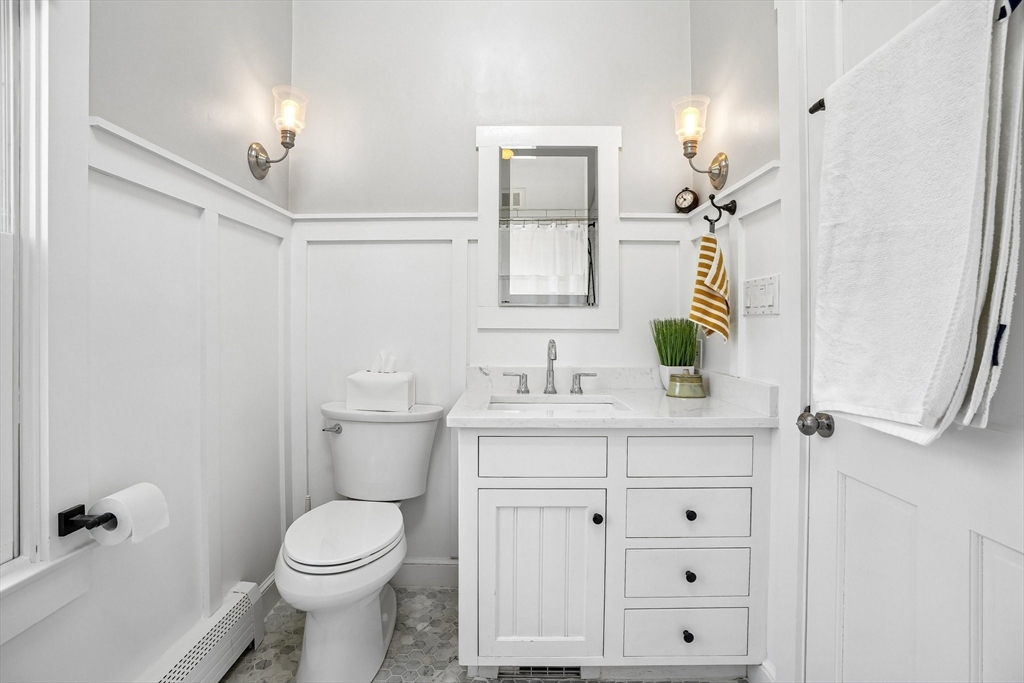 12 Hawley Road Scituate, MA 02066 - Photo 14 of 24 a bathroom with a sink a toilet and shower