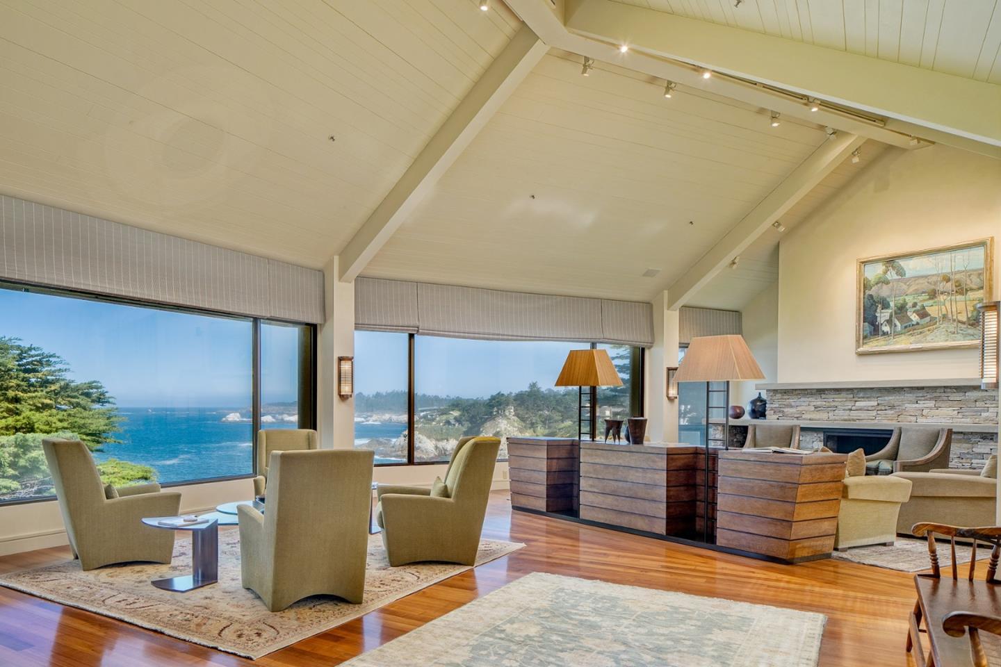 157-163 Spindrift Road Carmel, CA 93923 - Photo 52 of 100 a living room with furniture a rug and a painting on the wall