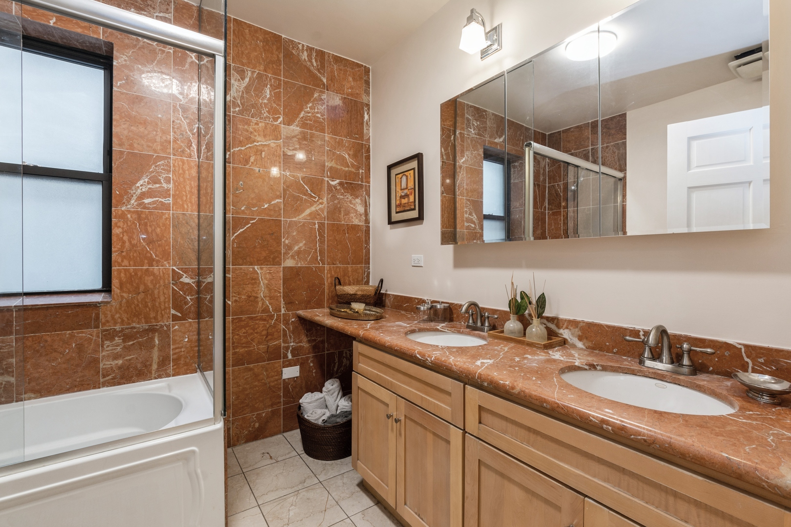 645 West Bittersweet Place, Unit 1 Chicago, IL 60613 - Photo 11 of 12 a bathroom with a sink a toilet and shower