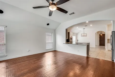 a kitchen with stainless steel appliances granite countertop a stove sink and cabinets