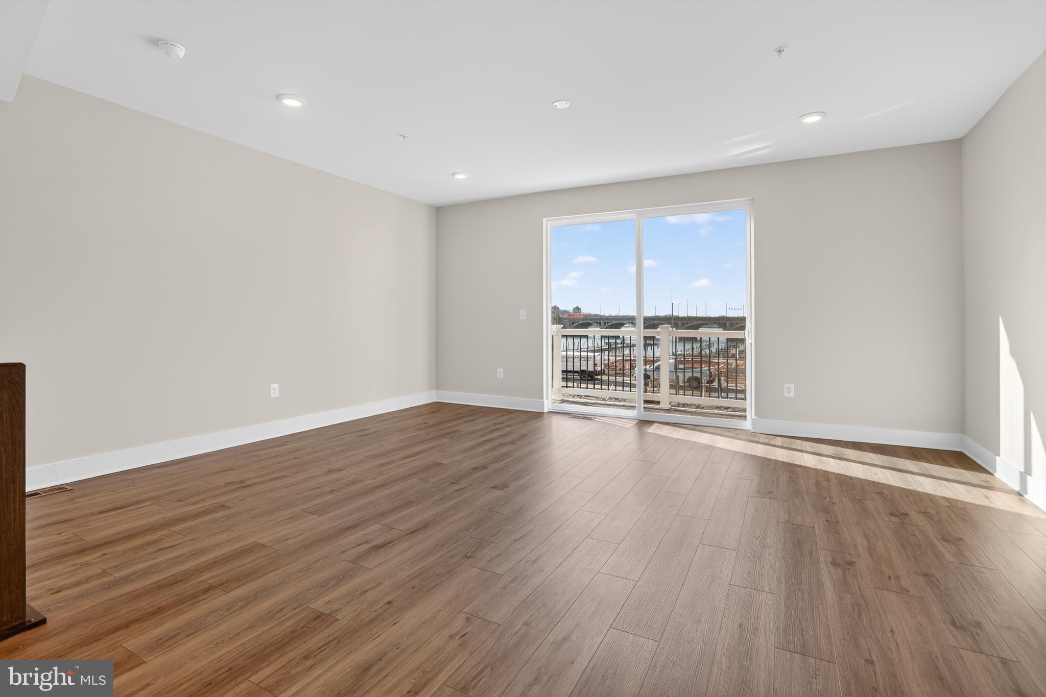 2716 Light Street Baltimore, MD 21230 - Photo 16 of 20 a view of wooden floor and windows in a room