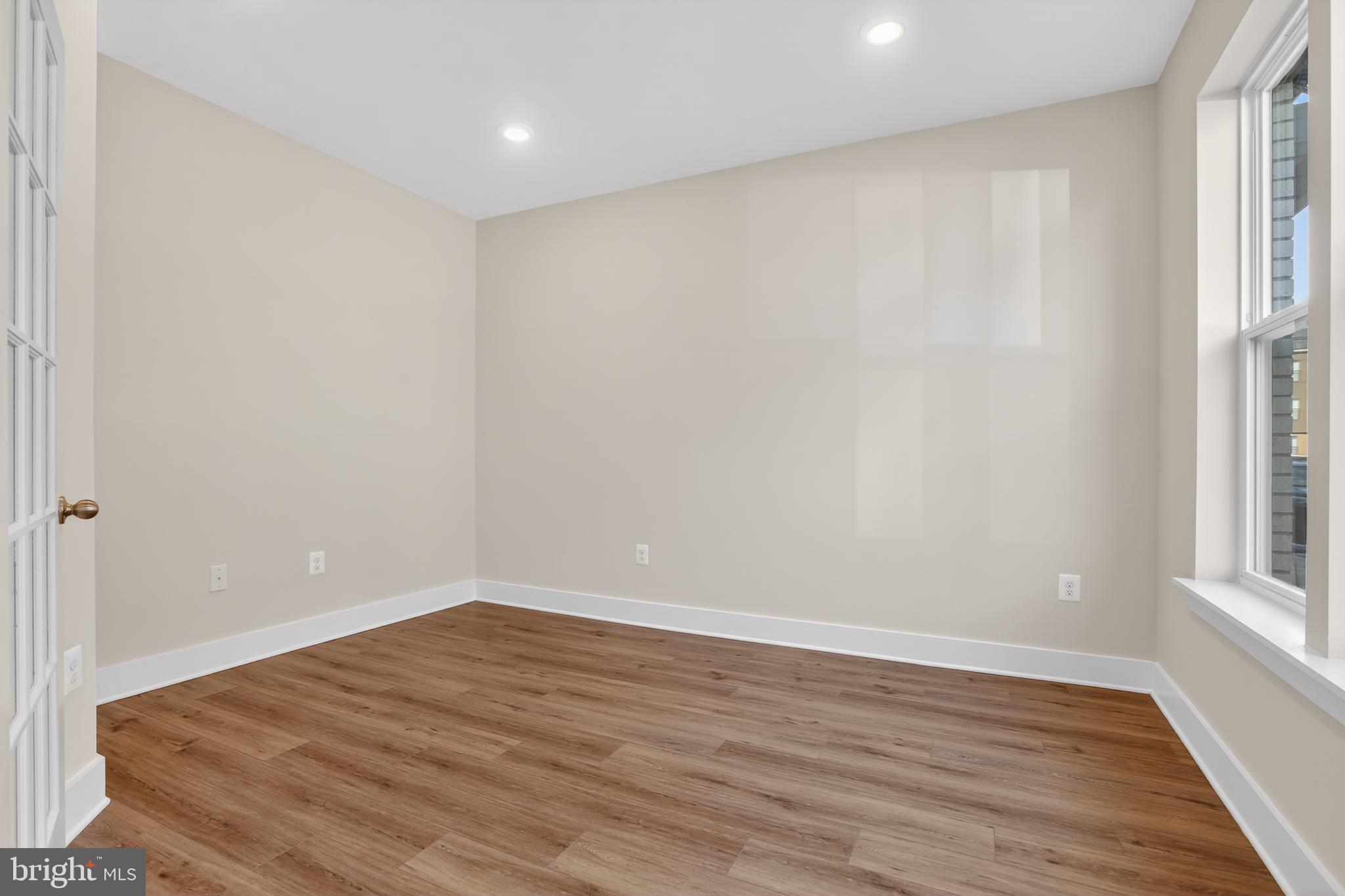 2716 Light Street Baltimore, MD 21230 - Photo 3 of 20 a view of empty room with wooden floor and fan