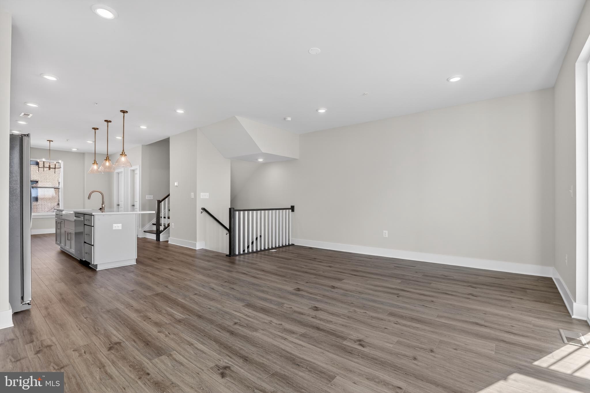 2716 Light Street Baltimore, MD 21230 - Photo 5 of 20 a view of a big room with wooden floor and windows