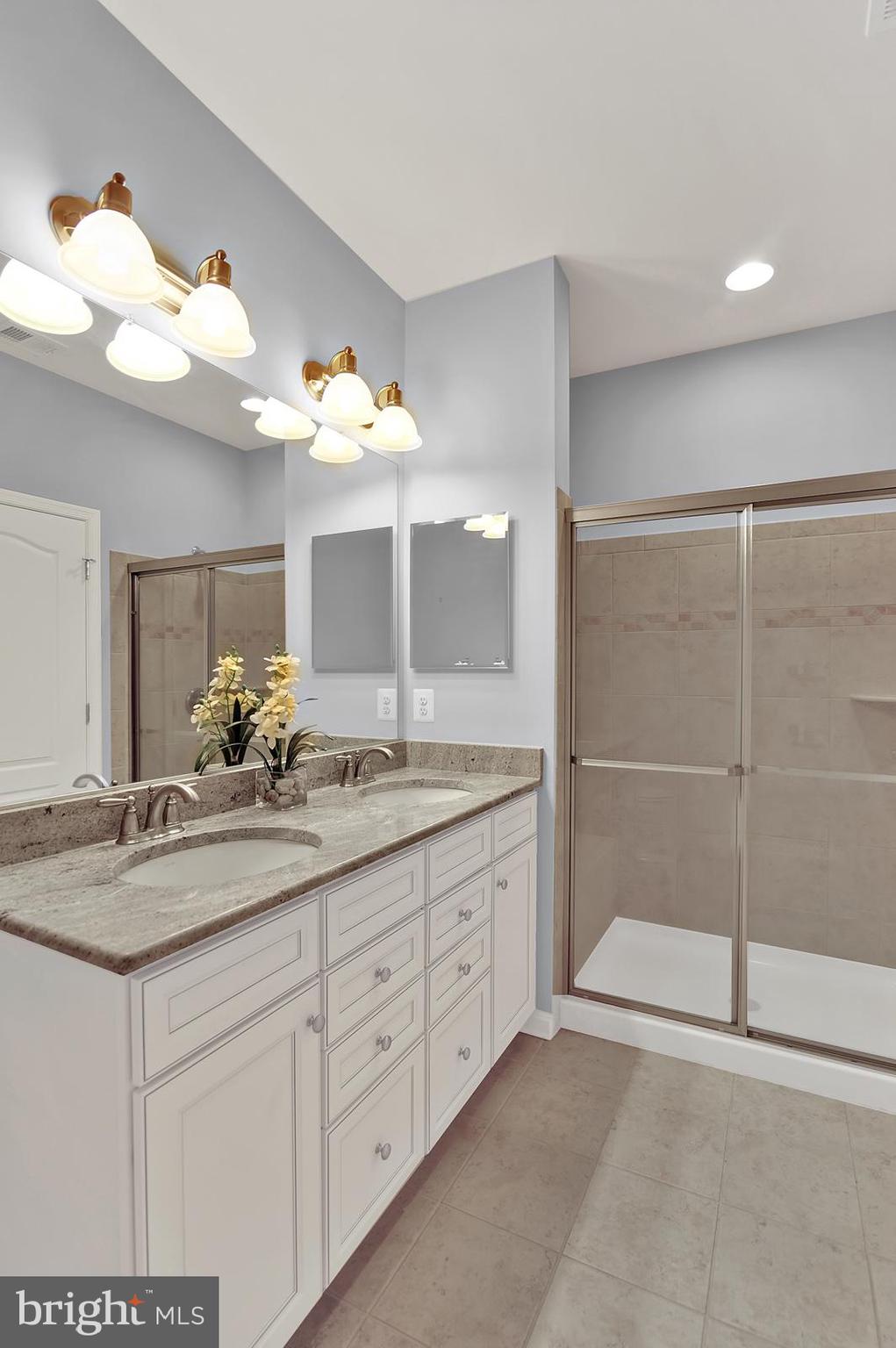 16 Fuji Court Dover, DE 19901 - Photo 11 of 13 a bathroom with a sink vanity and a mirror