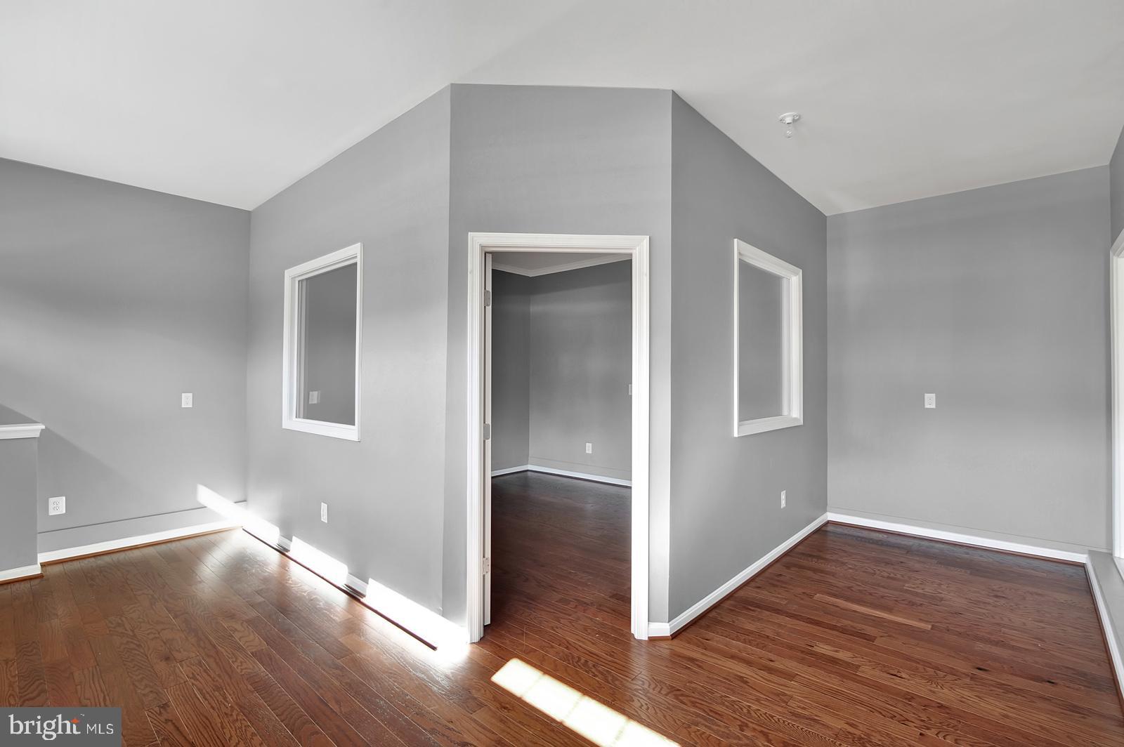 16 Fuji Court Dover, DE 19901 - Photo 12 of 13 a view of an empty room with wooden floor & closet
