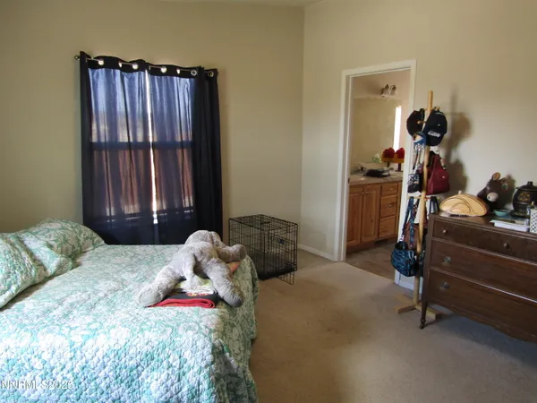a bedroom with a bed and cabinets