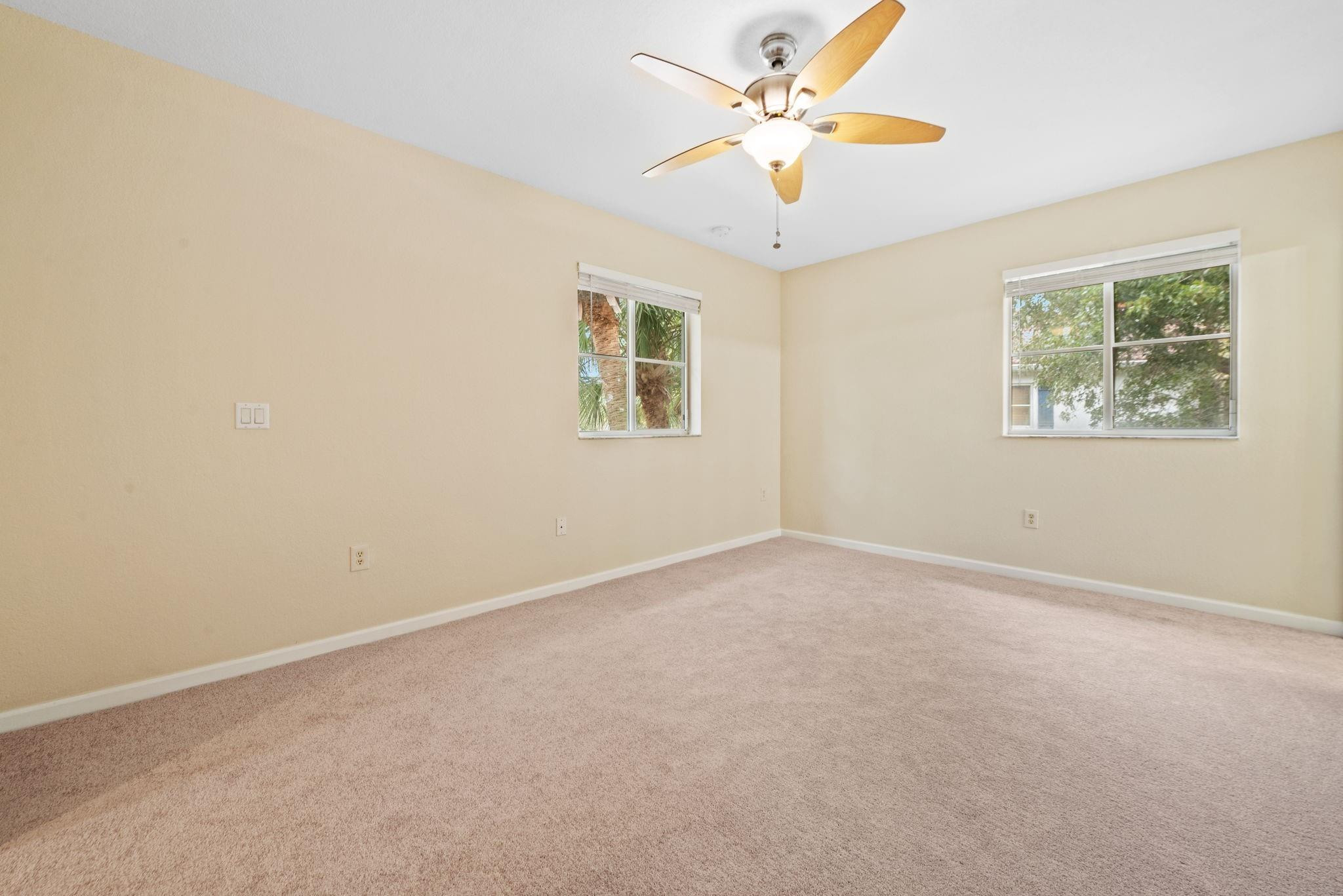 8299 Southwest 27th Street, Unit 101 Miramar, FL 33025 - Photo 14 of 30 an empty room with a window and a fan