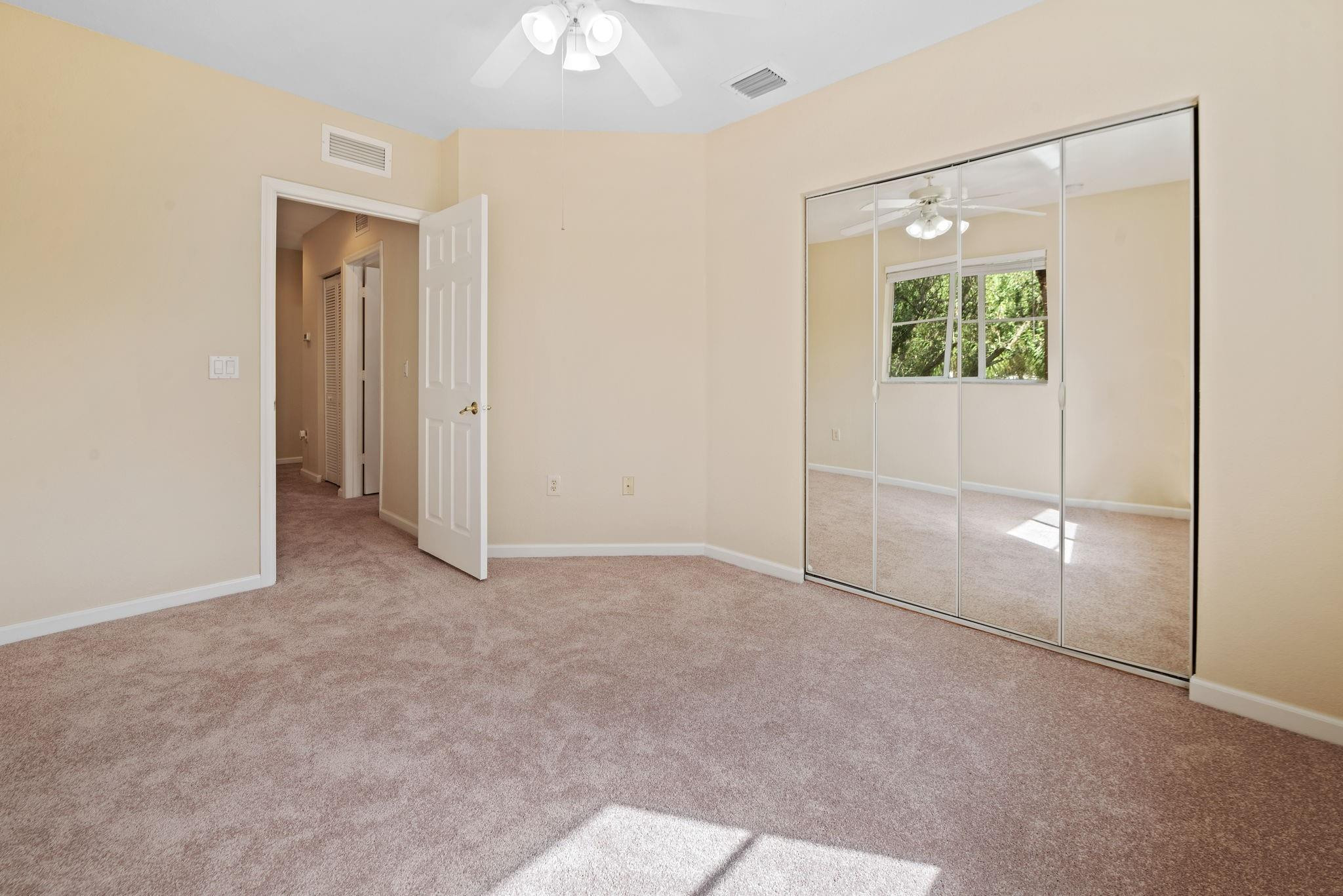8299 Southwest 27th Street, Unit 101 Miramar, FL 33025 - Photo 17 of 30 an empty room with windows and closet