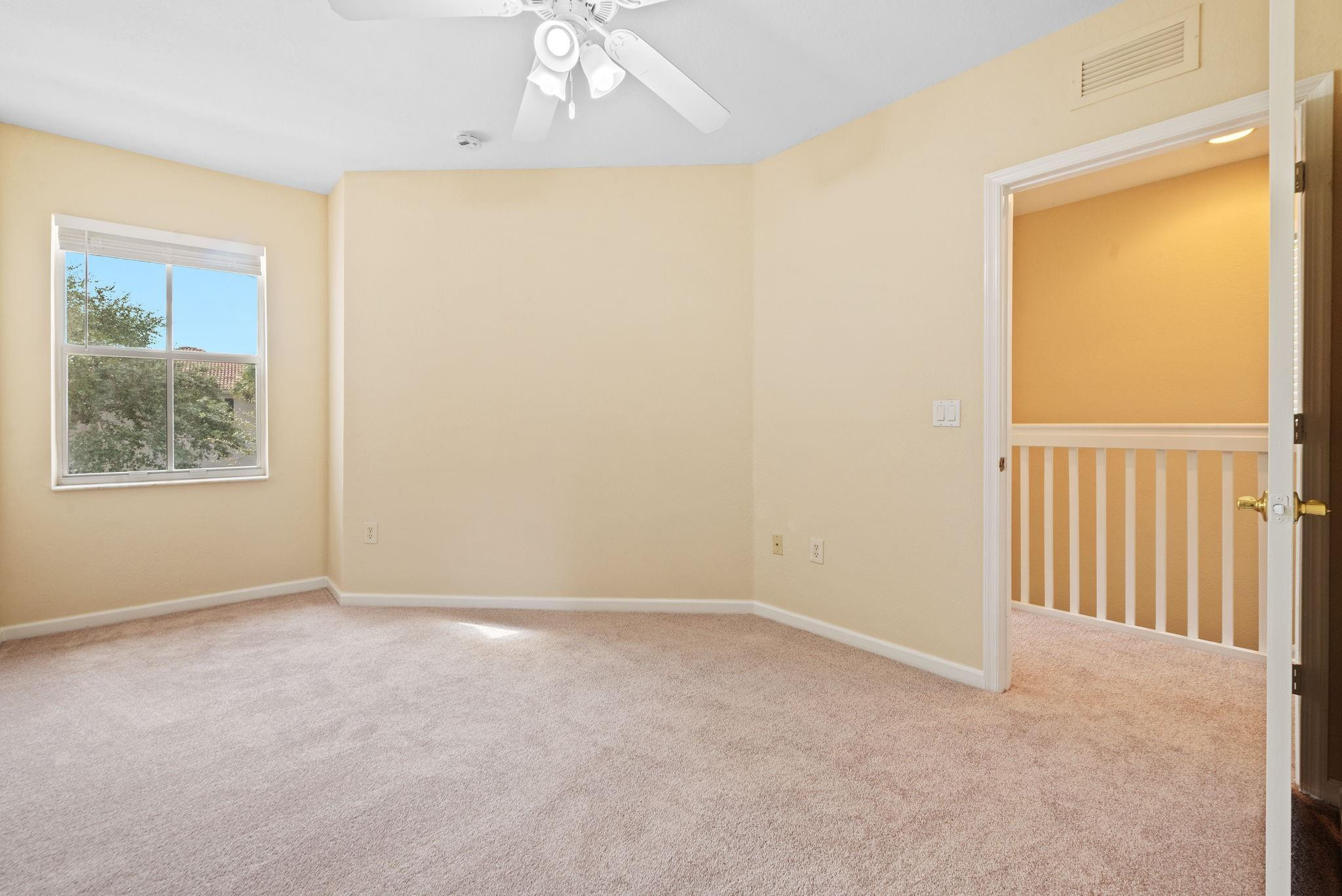 8299 Southwest 27th Street, Unit 101 Miramar, FL 33025 - Photo 20 of 30 an empty room with windows and closet