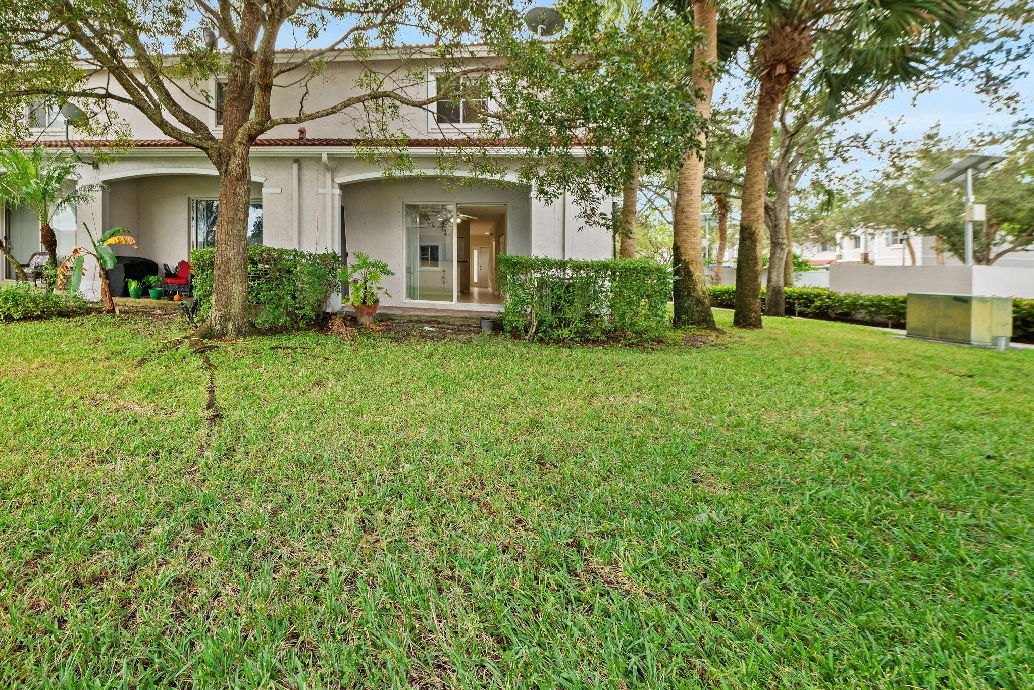8299 Southwest 27th Street, Unit 101 Miramar, FL 33025 - Photo 24 of 30 a view of a yard in front of house