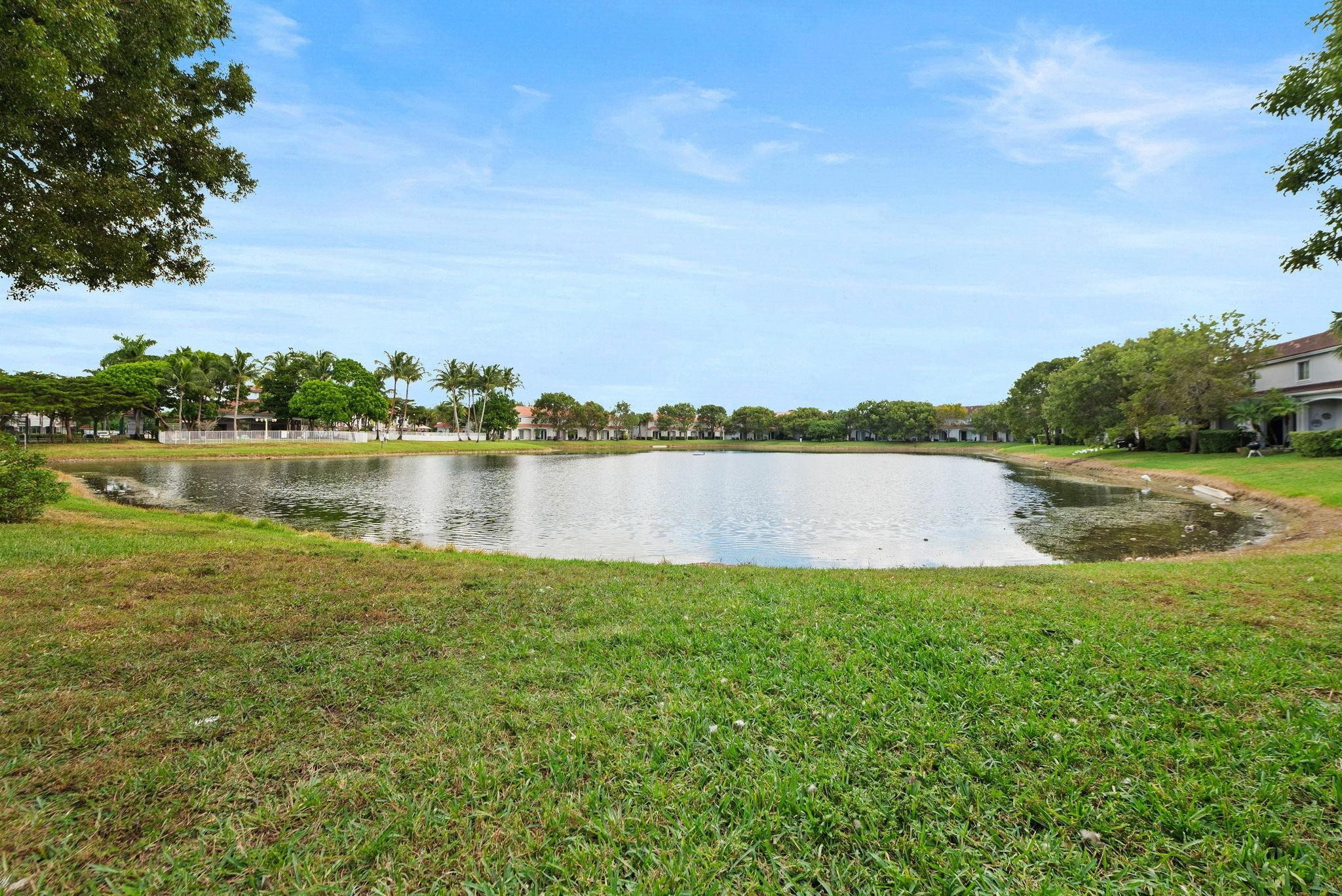 8299 Southwest 27th Street, Unit 101 Miramar, FL 33025 - Photo 25 of 30 a view of a lake with houses in the back