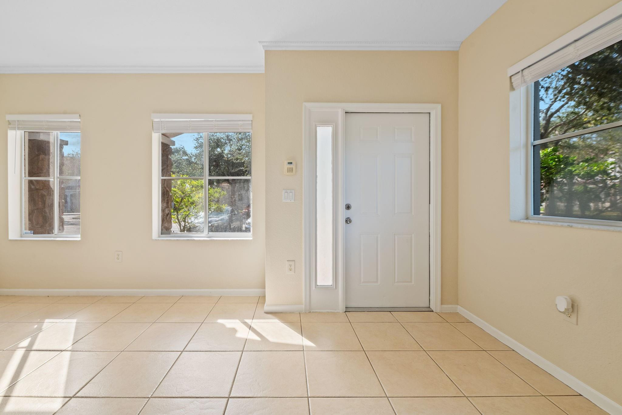8299 Southwest 27th Street, Unit 101 Miramar, FL 33025 - Photo 3 of 30 a view of an empty room with a window