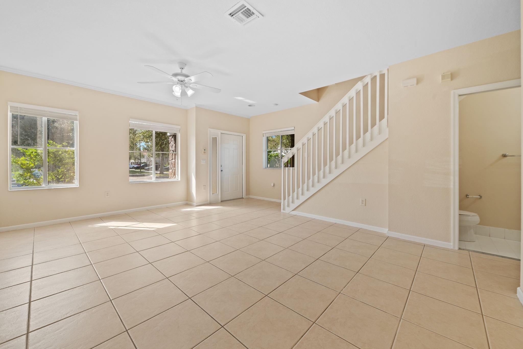 8299 Southwest 27th Street, Unit 101 Miramar, FL 33025 - Photo 4 of 30 a view of an empty room with windows