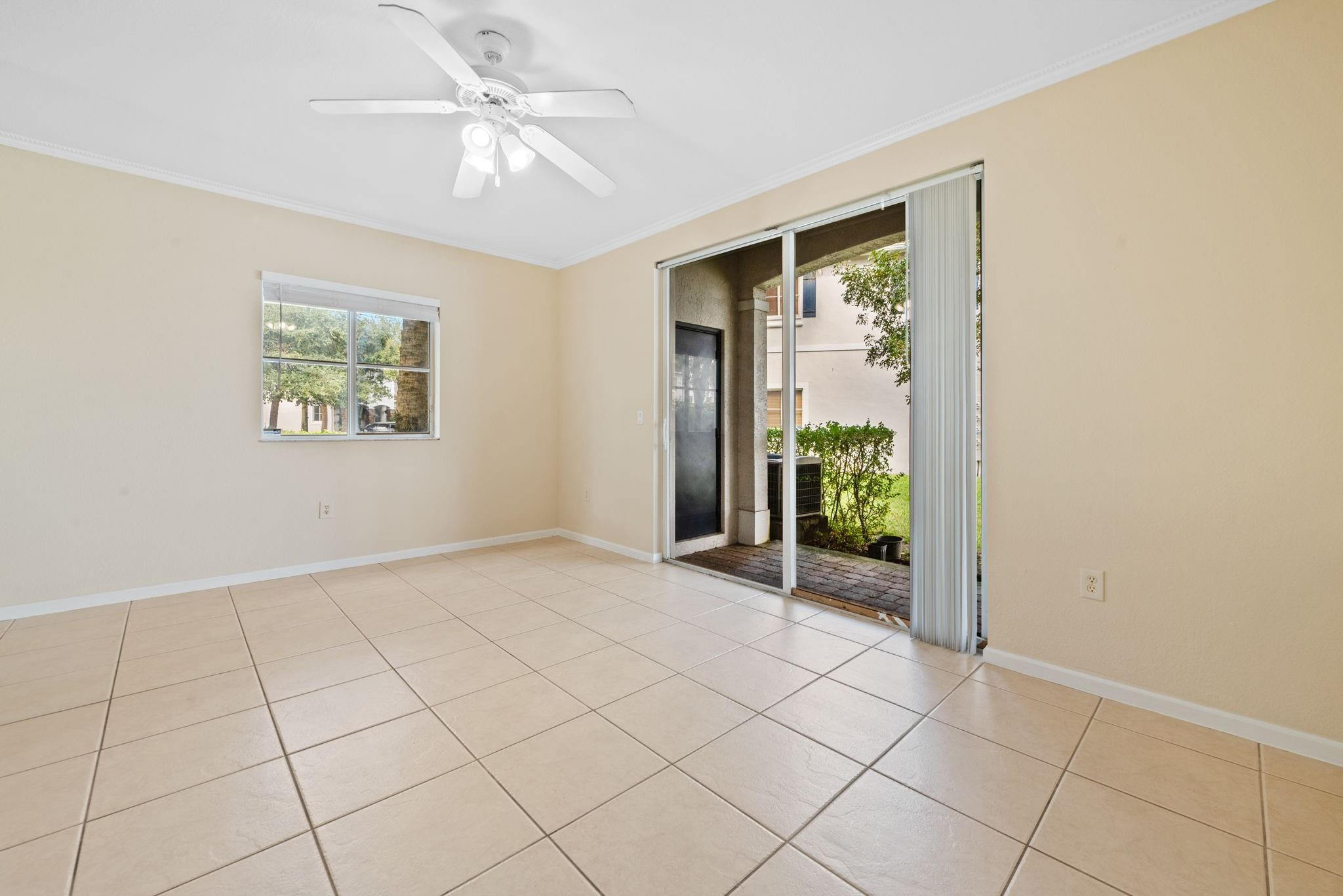 8299 Southwest 27th Street, Unit 101 Miramar, FL 33025 - Photo 8 of 30 an empty room with windows and closet
