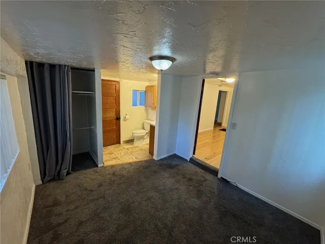 a white toilet sitting next to a sink