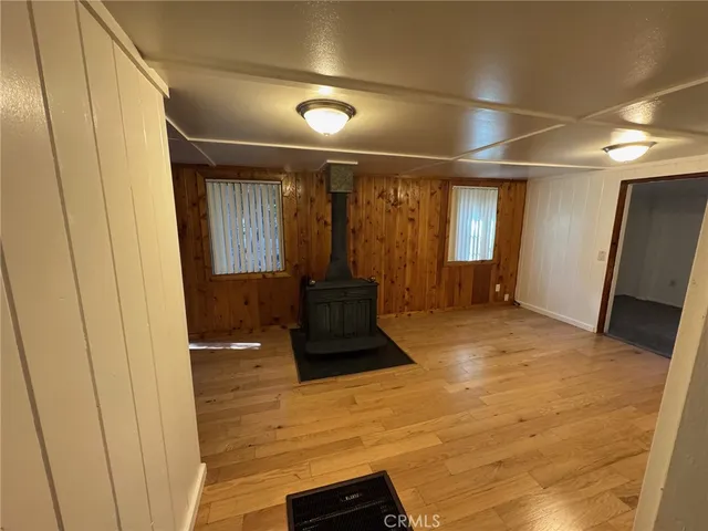 a room with a large mirror and furniture