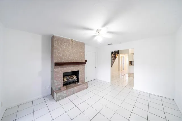 a view of an empty room with fire place