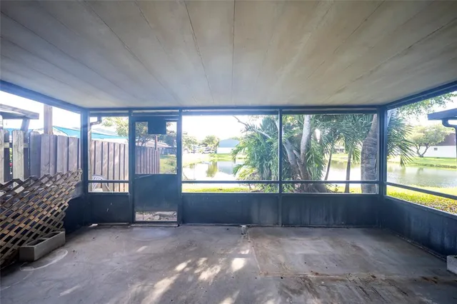 a view of an empty room and a window