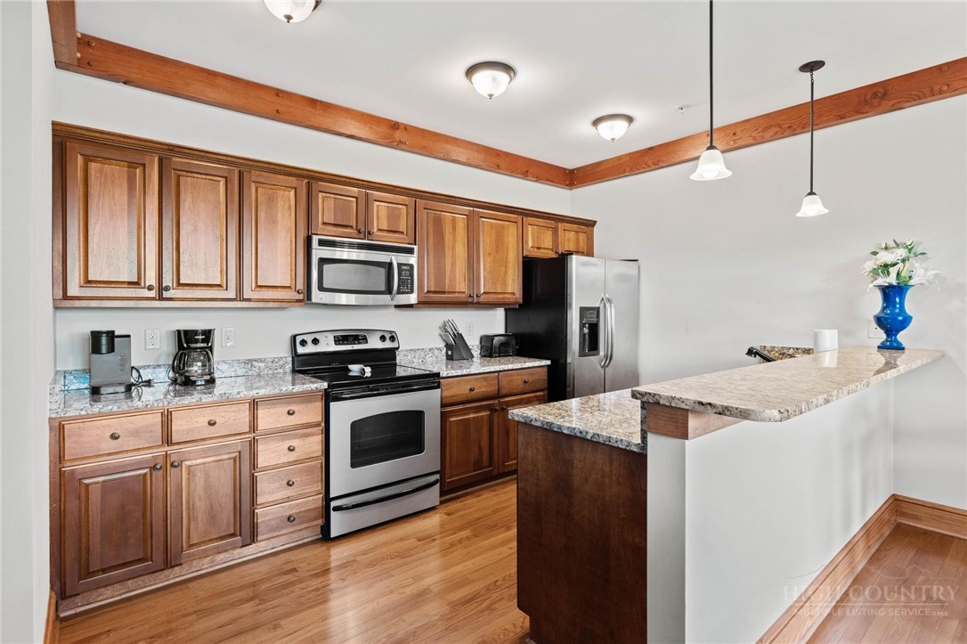 142 Evening View Lane, Unit CA3 Boone, NC 28607 - Photo 7 of 41 a kitchen with granite countertop a sink and steel appliances