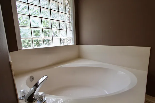 a close up of a bathtub in a window