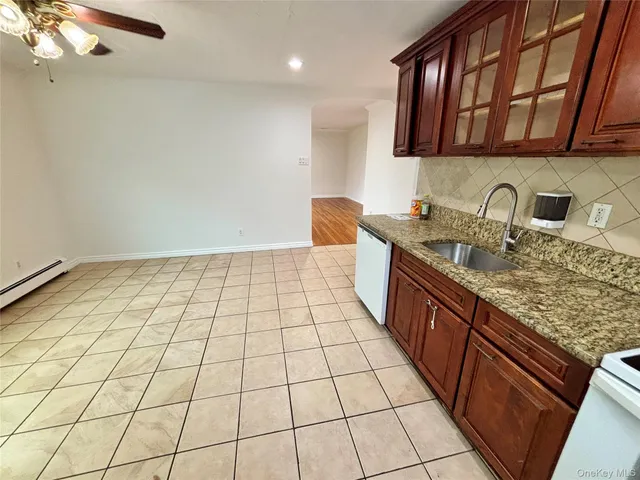 a kitchen with a sink and a stove top oven