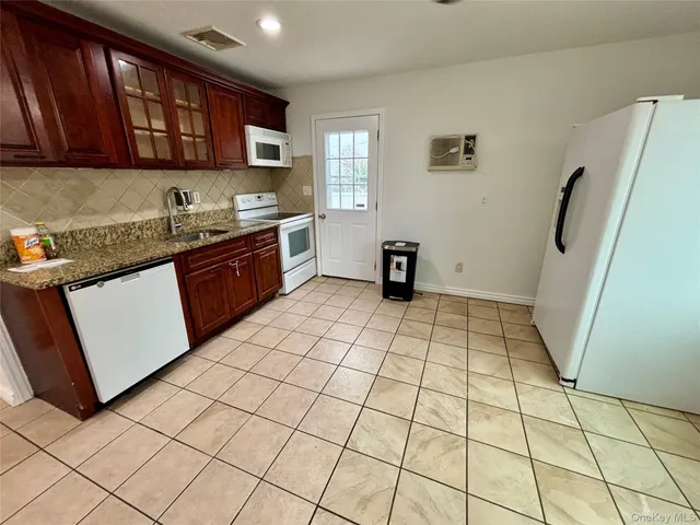 a kitchen with stainless steel appliances a sink and a cabinets