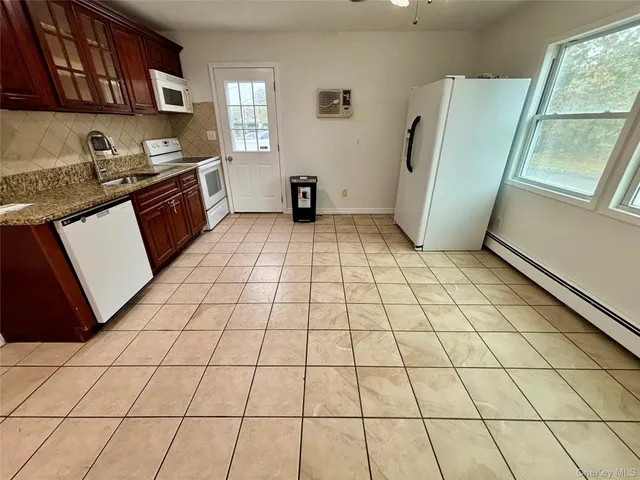 a kitchen with stainless steel appliances a sink and a cabinets