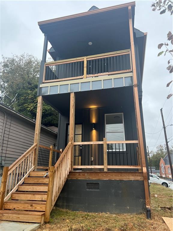 a view of a house with wooden stairs