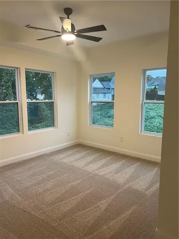 a view of an empty room with a window