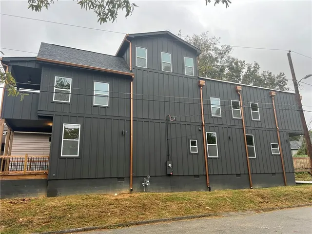 a front view of a house with lake