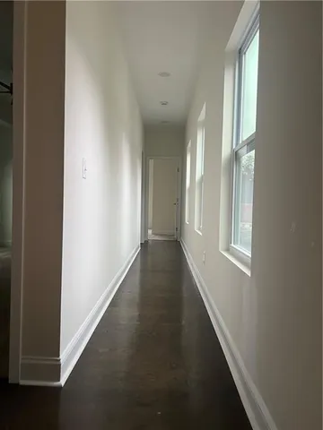 a view of a hallway with windows