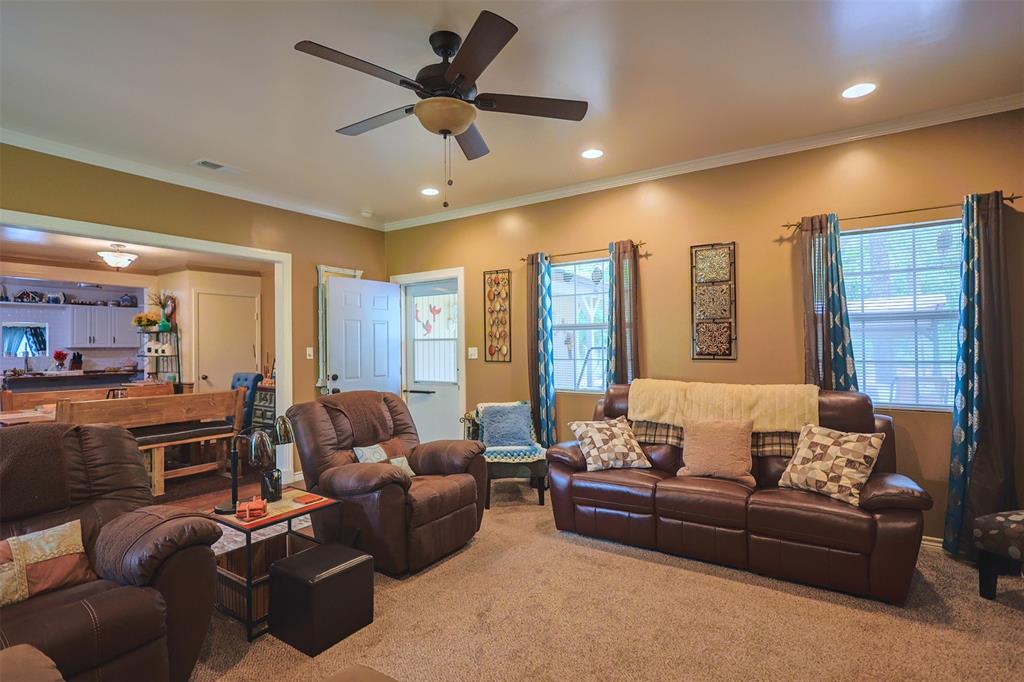309 Tejas Trail Springtown, TX 76082 - Photo 6 of 40 a living room with furniture and a large window