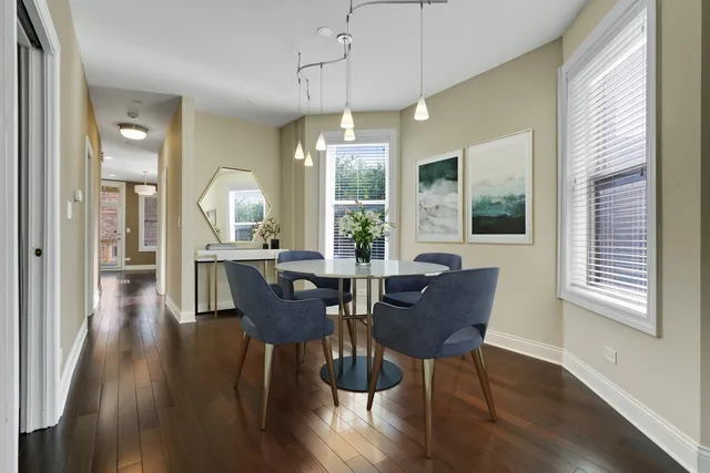 a view of a dining room with furniture window and wooden floor