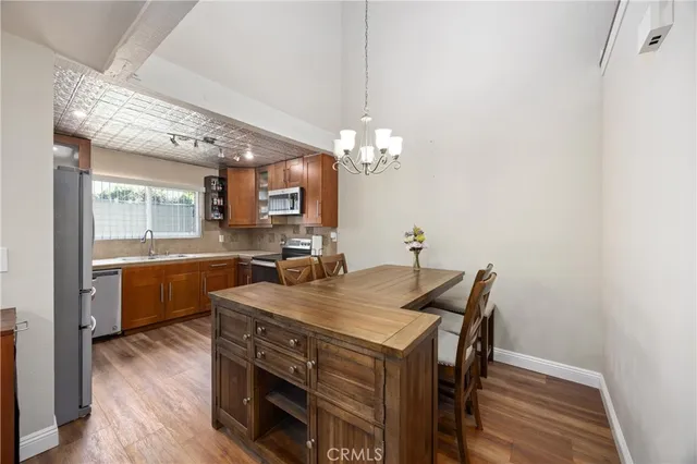 a view of kitchen and dining room with wooden floor