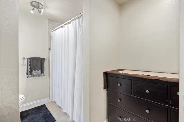 a room with a cabinet and a mirror